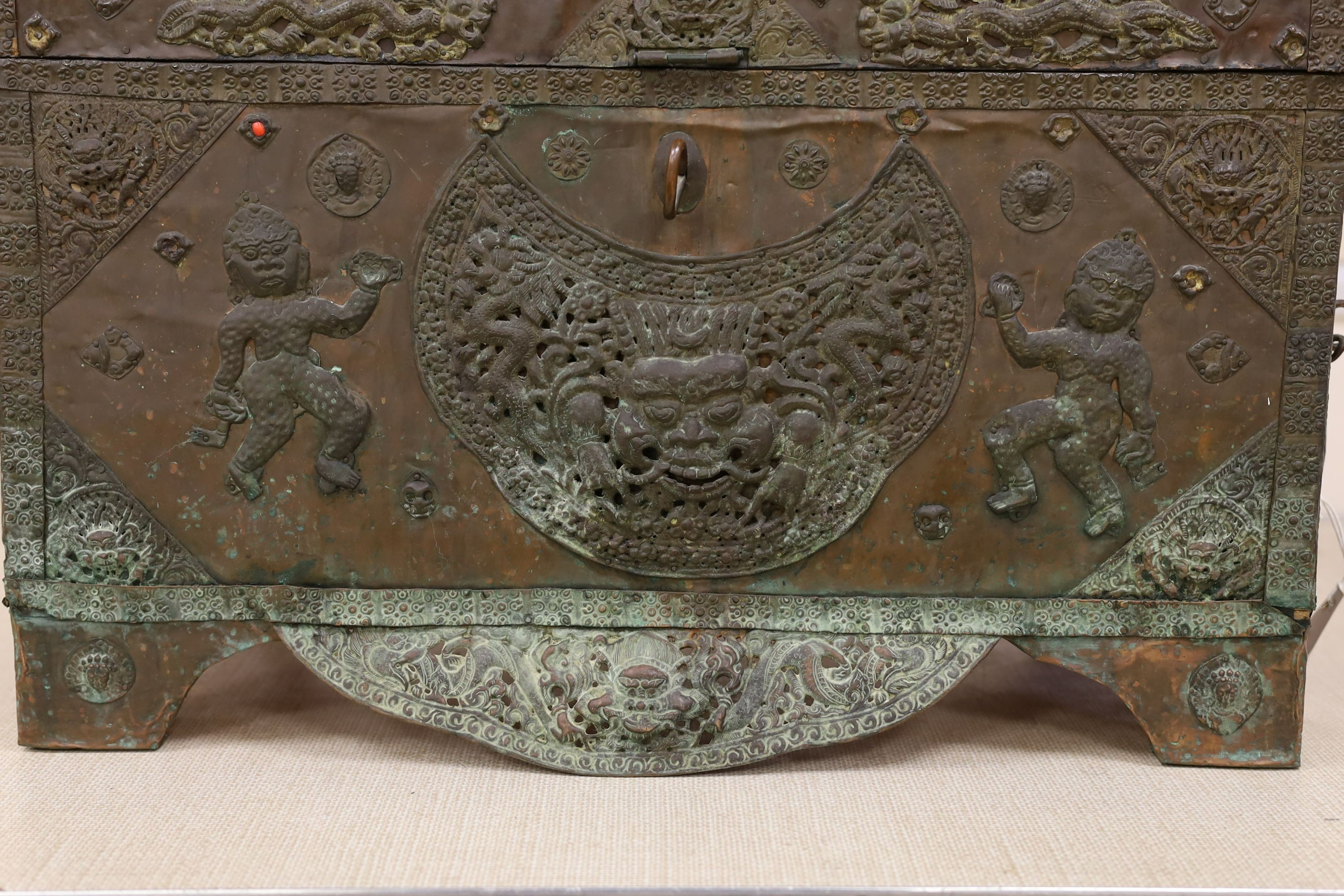 A Tibetan copper repousse-work casket, 20th century, 65cm wide, 49.5cm